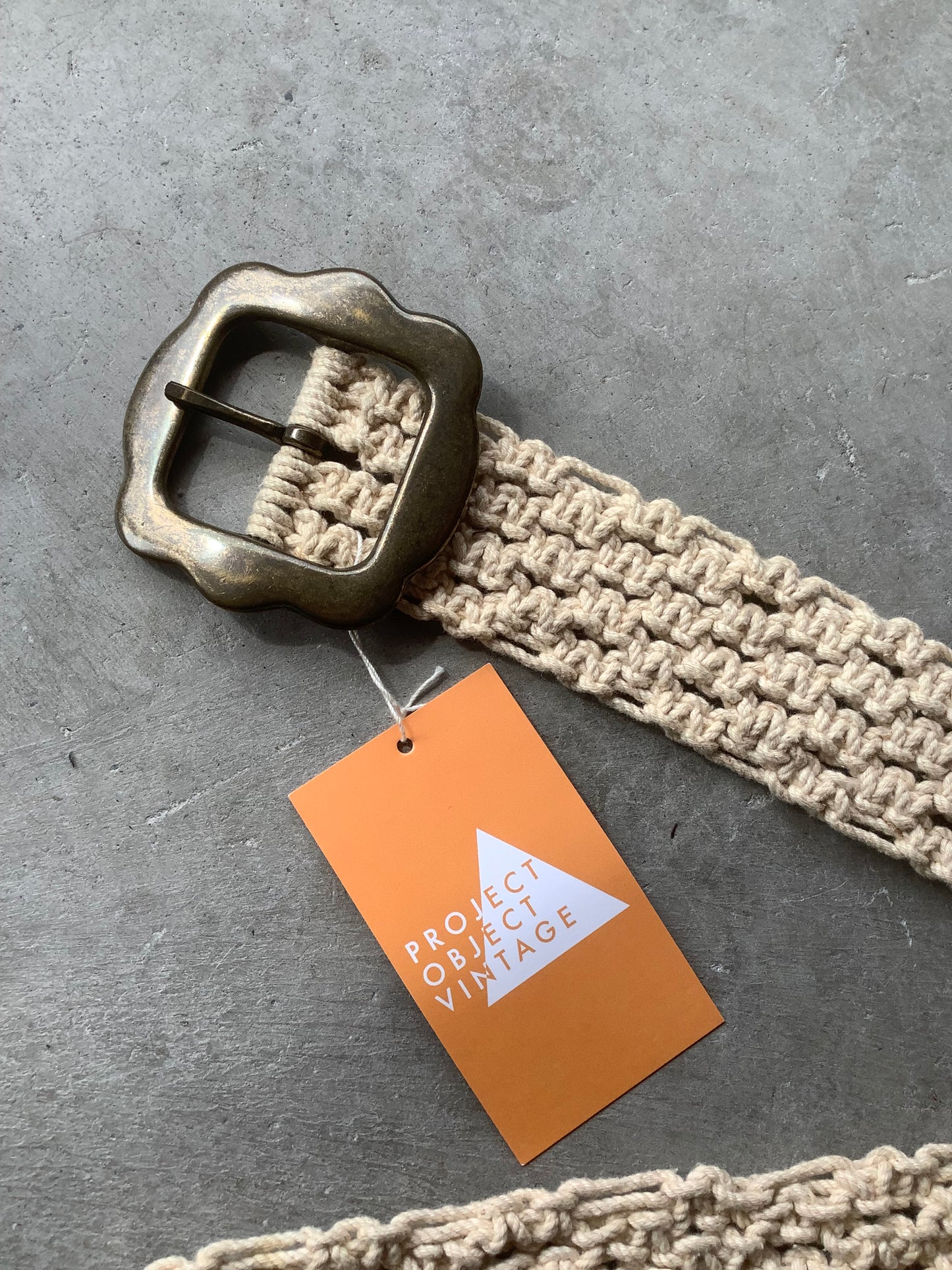 Cream crochet and brass belt