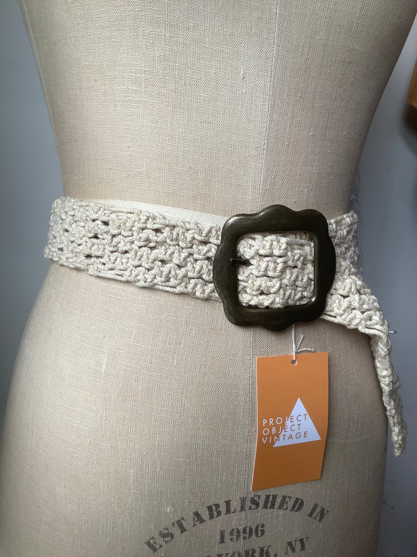 Cream crochet and brass belt