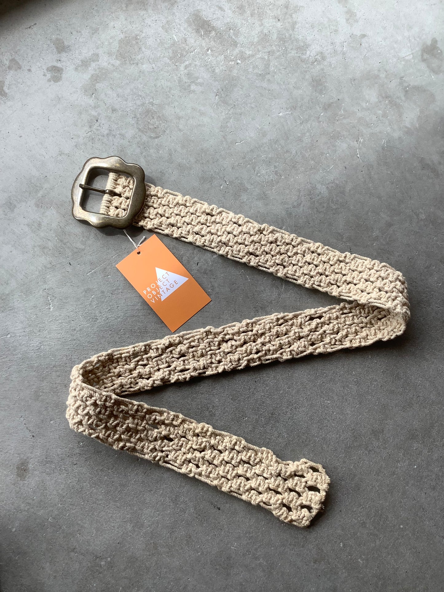 Cream crochet and brass belt