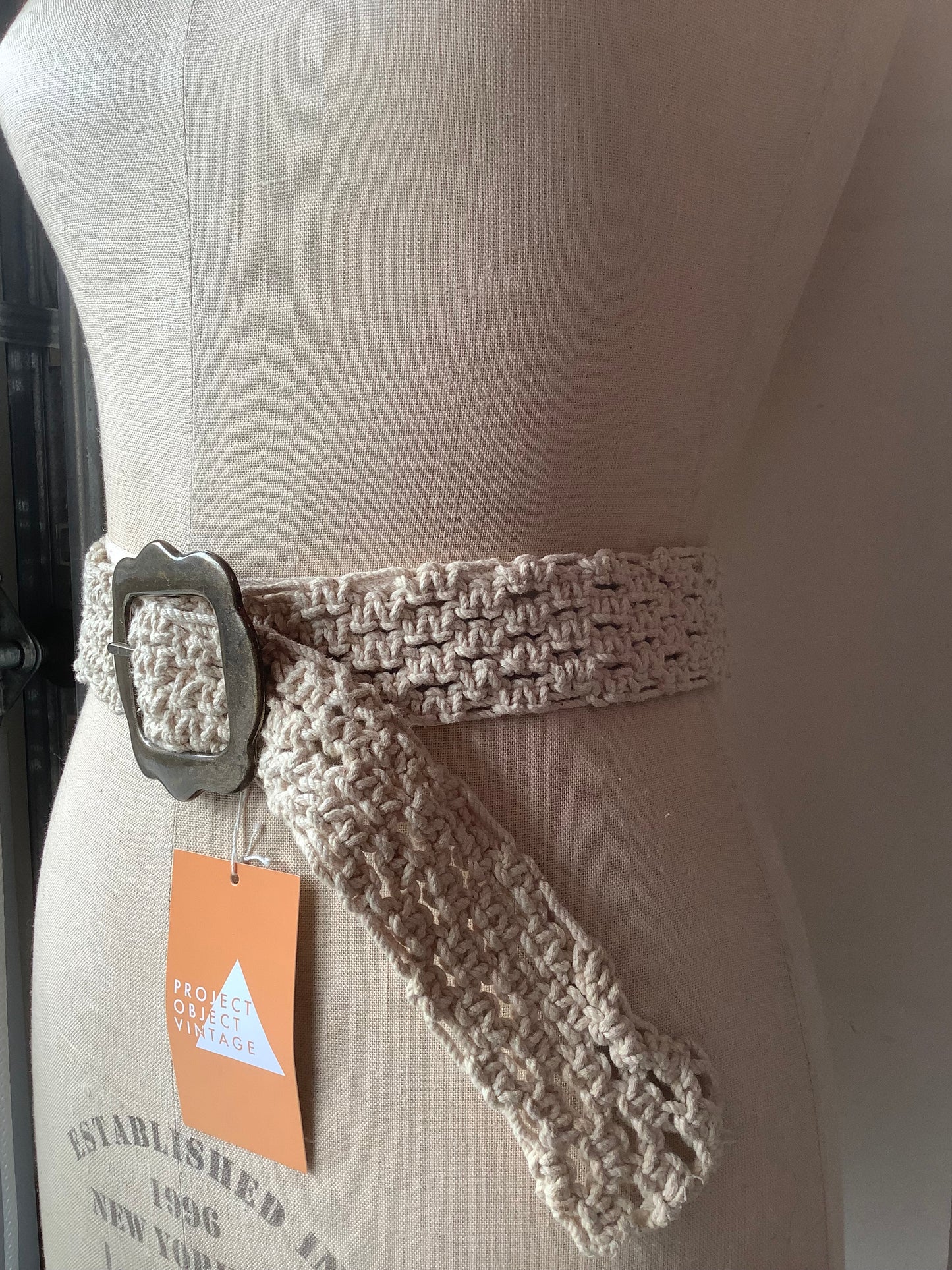 Cream crochet and brass belt