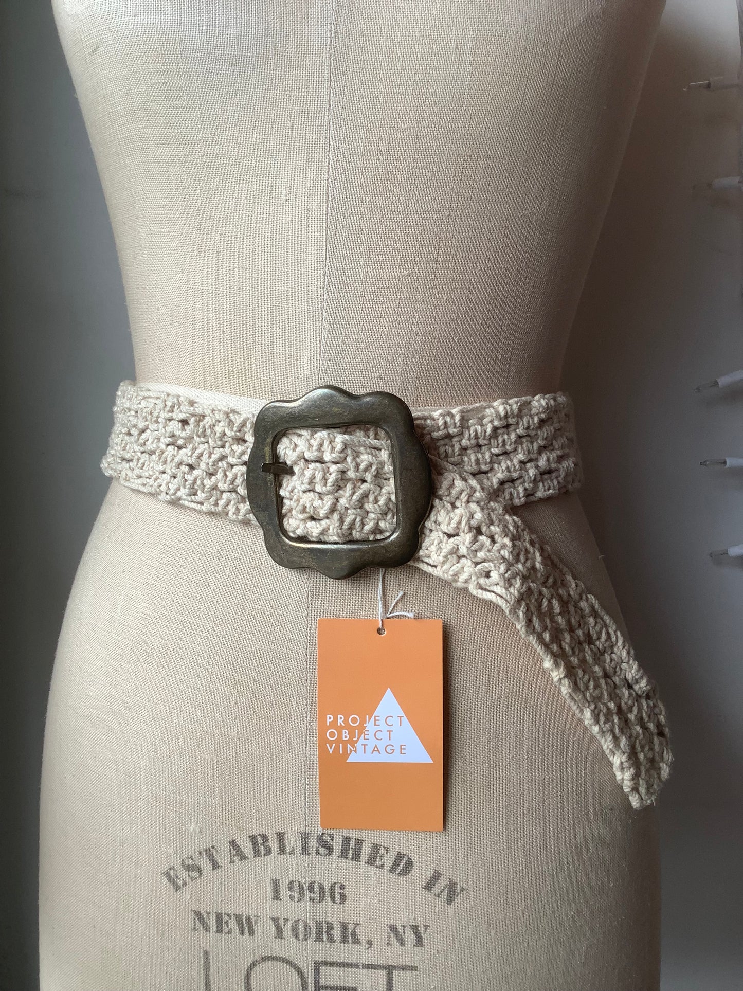 Cream crochet and brass belt