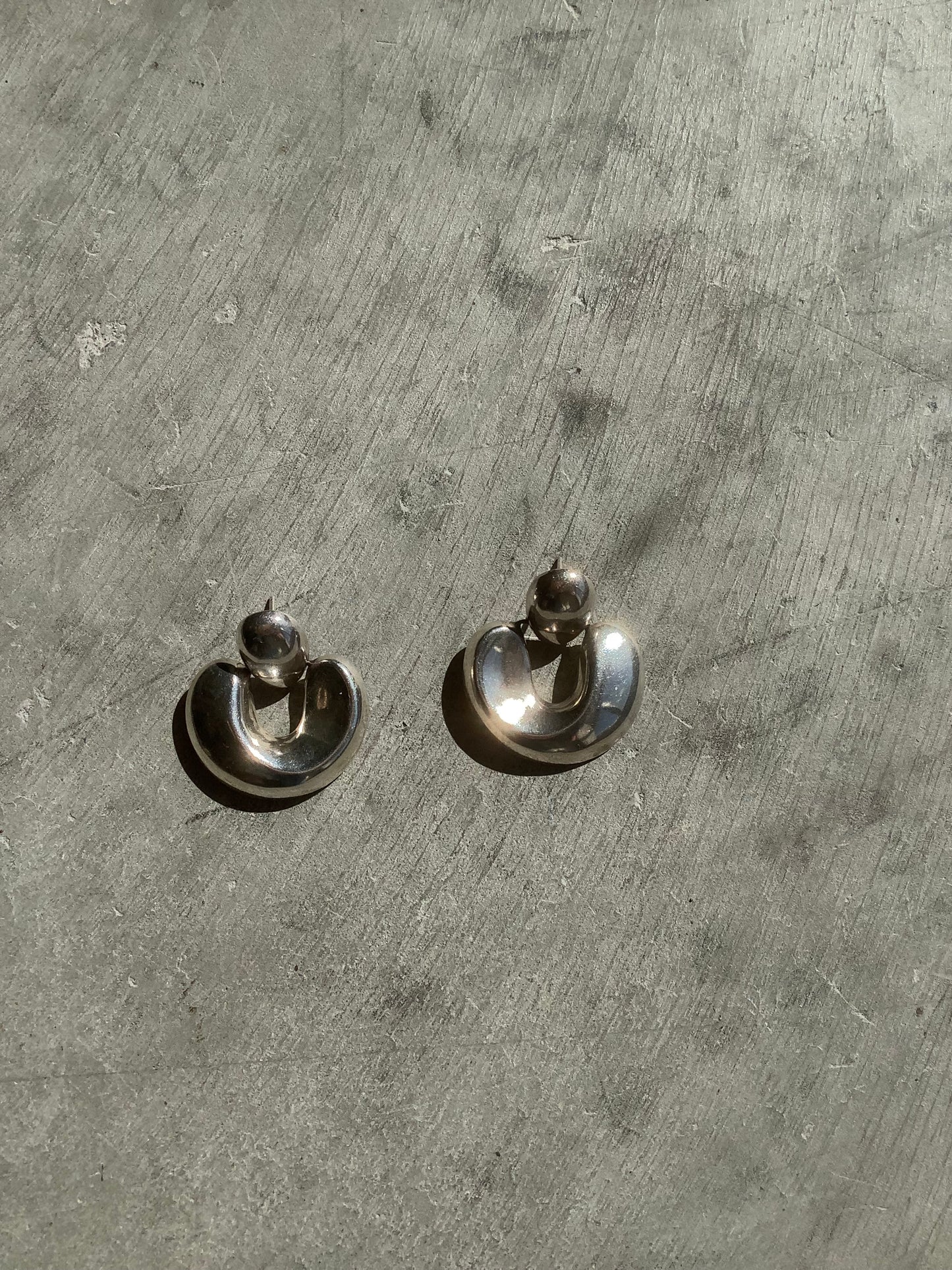 Sterling silver puffy door knocker earrings
