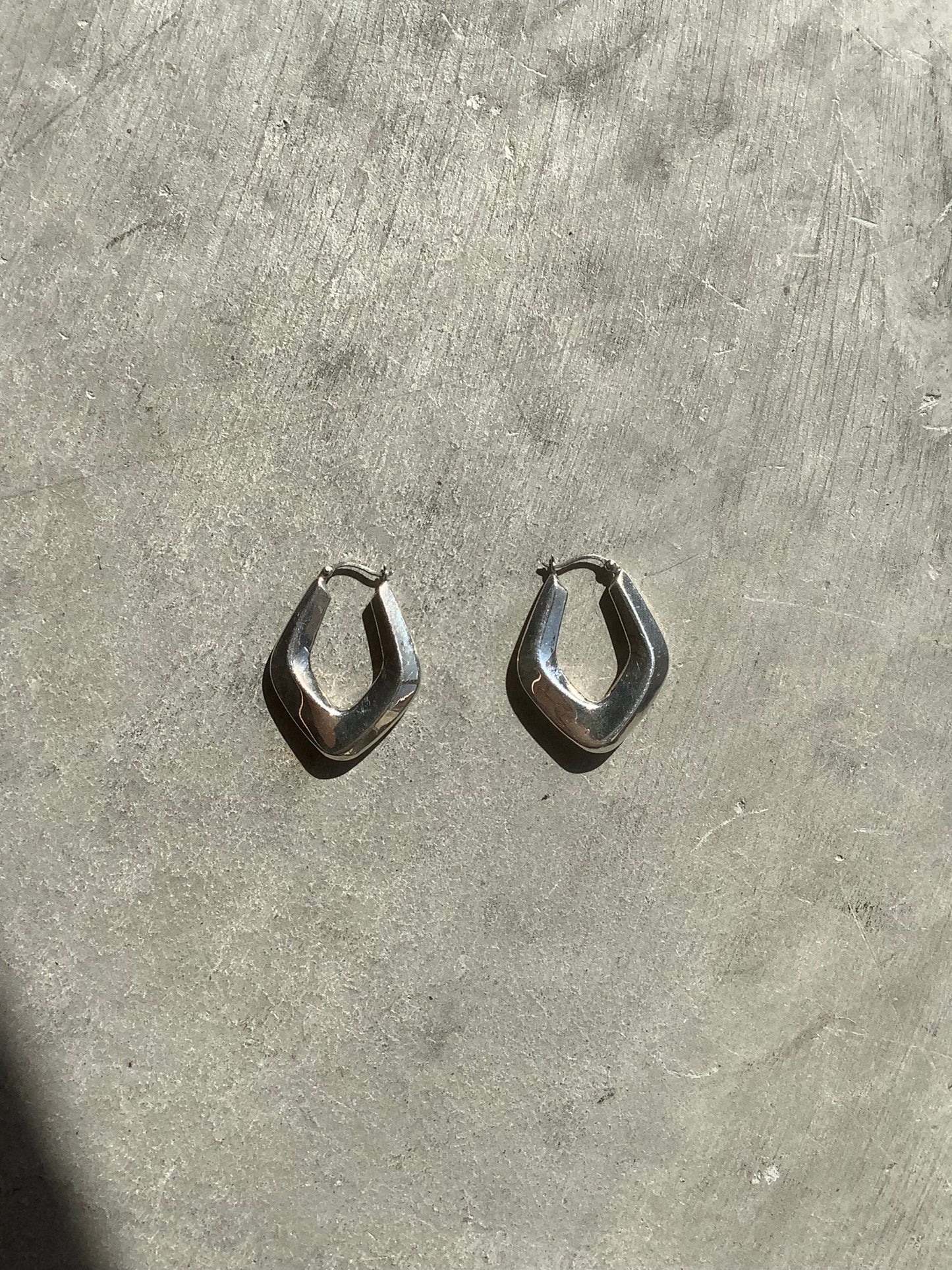 Sterling silver puffy diamond hoops