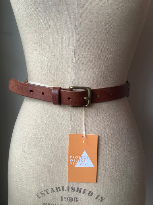 Brown leather and brass rivet belt