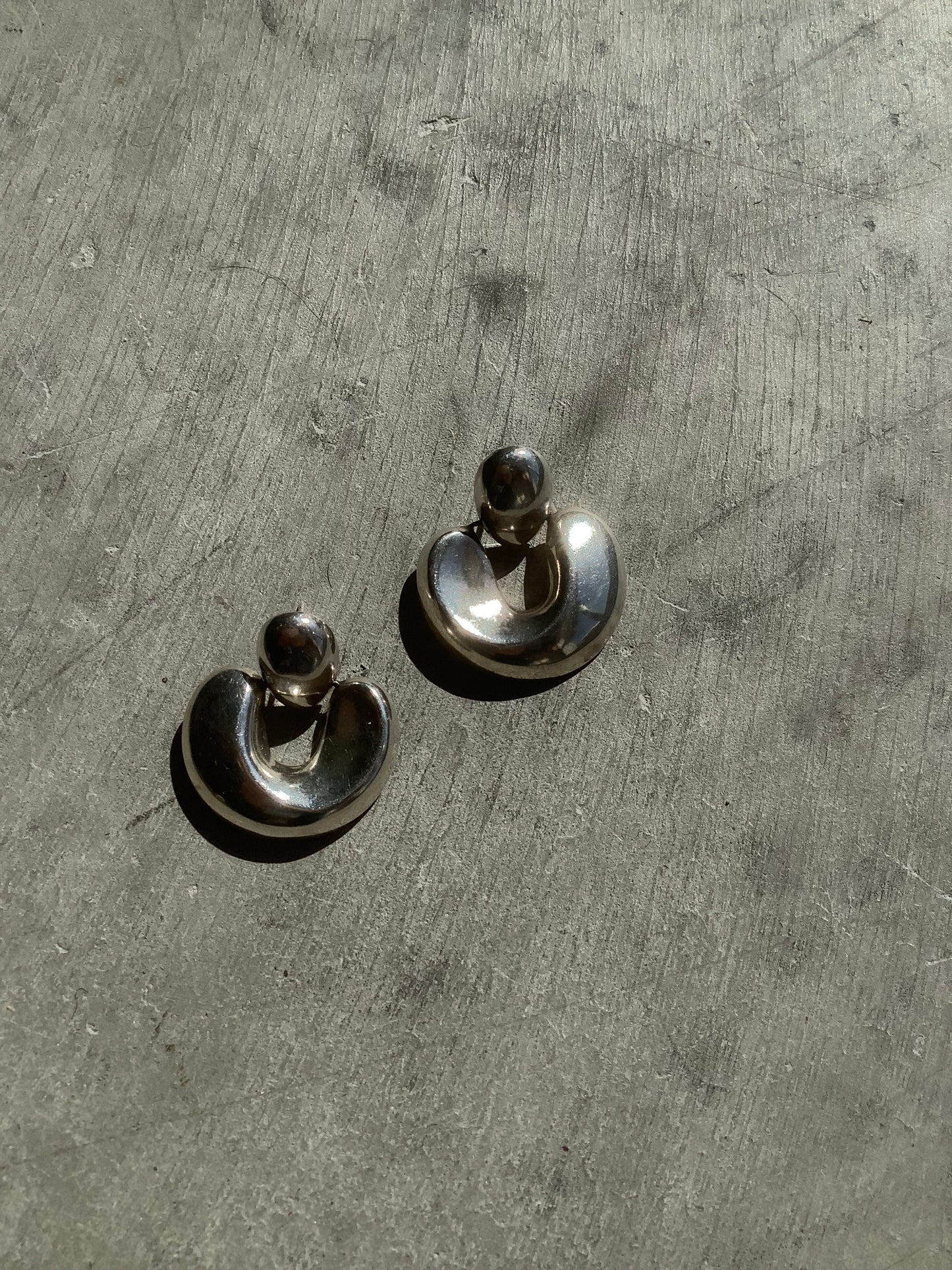 Sterling silver puffy door knocker earrings