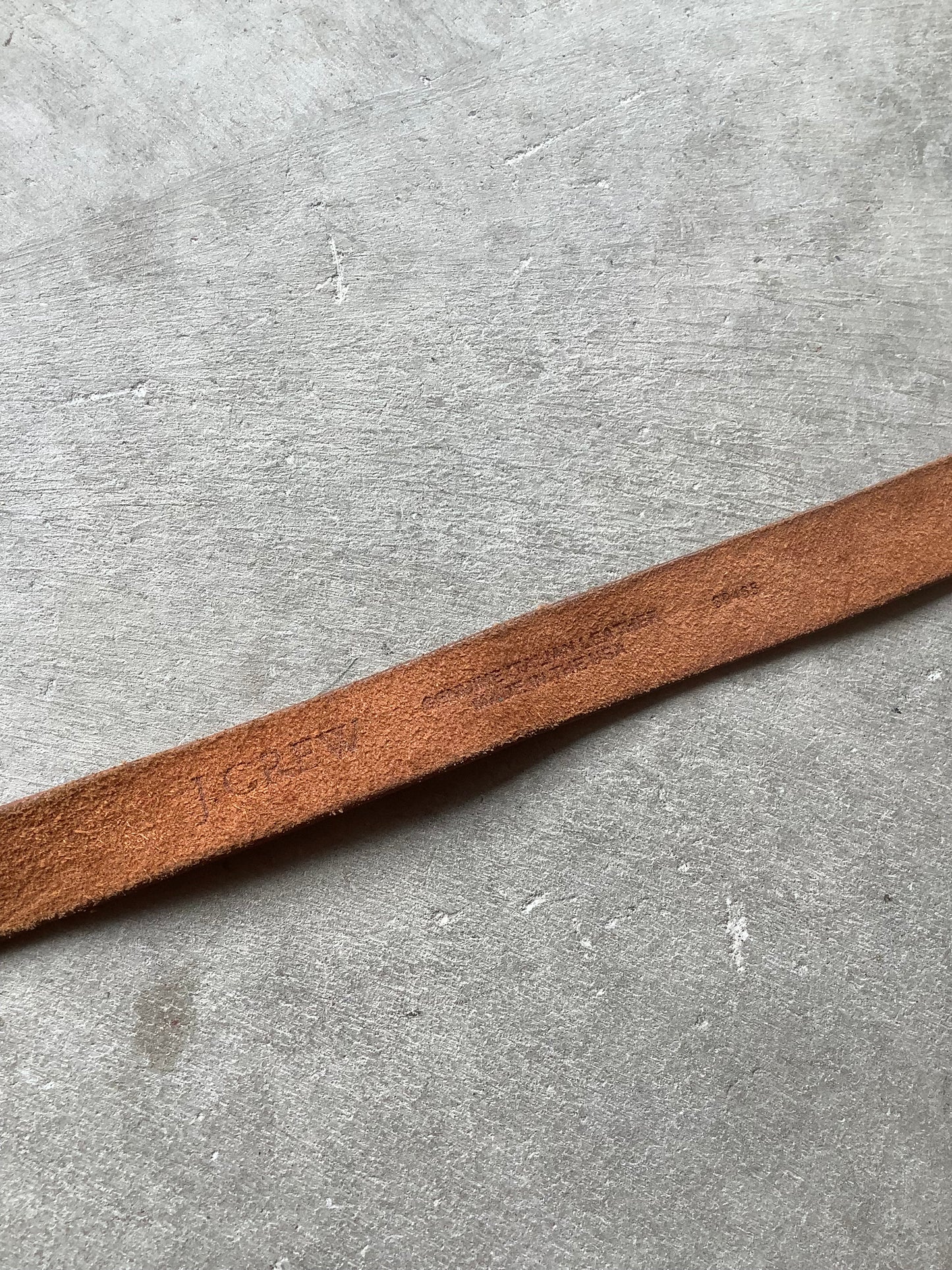 Brown leather and brass rivet belt