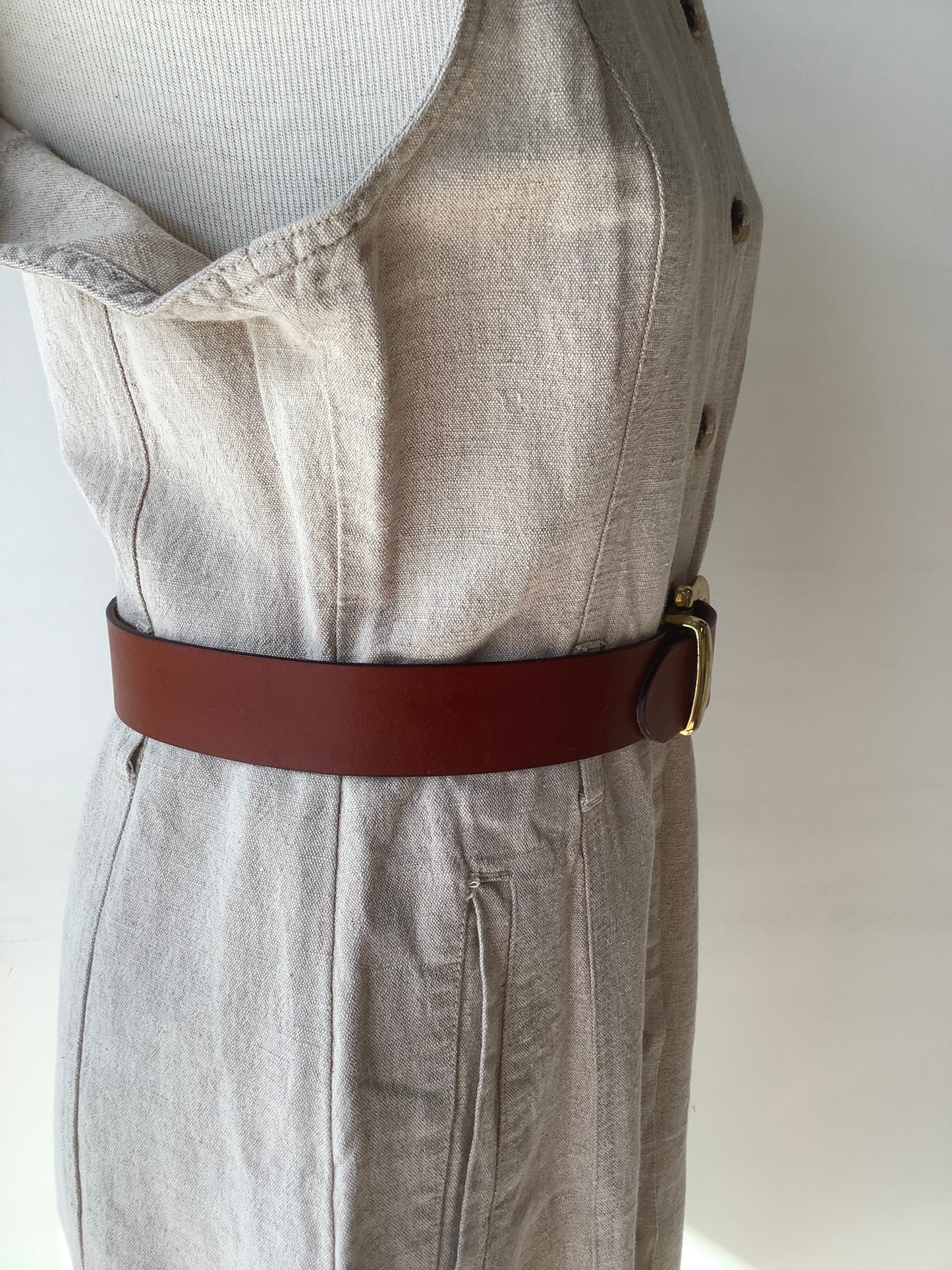 Brown leather belt with gold buckle